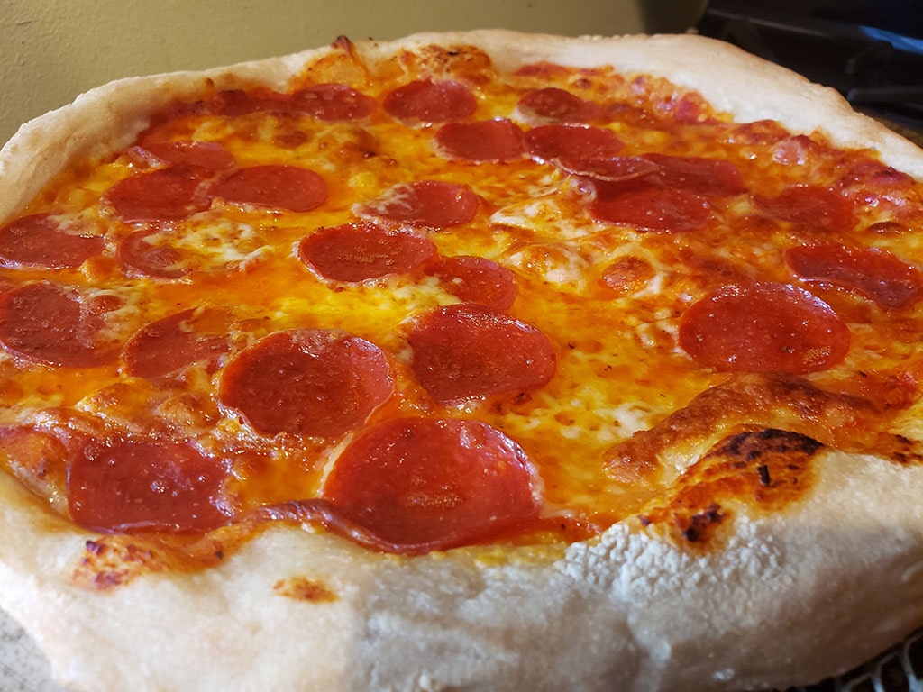 homemade pizza on big green egg grill